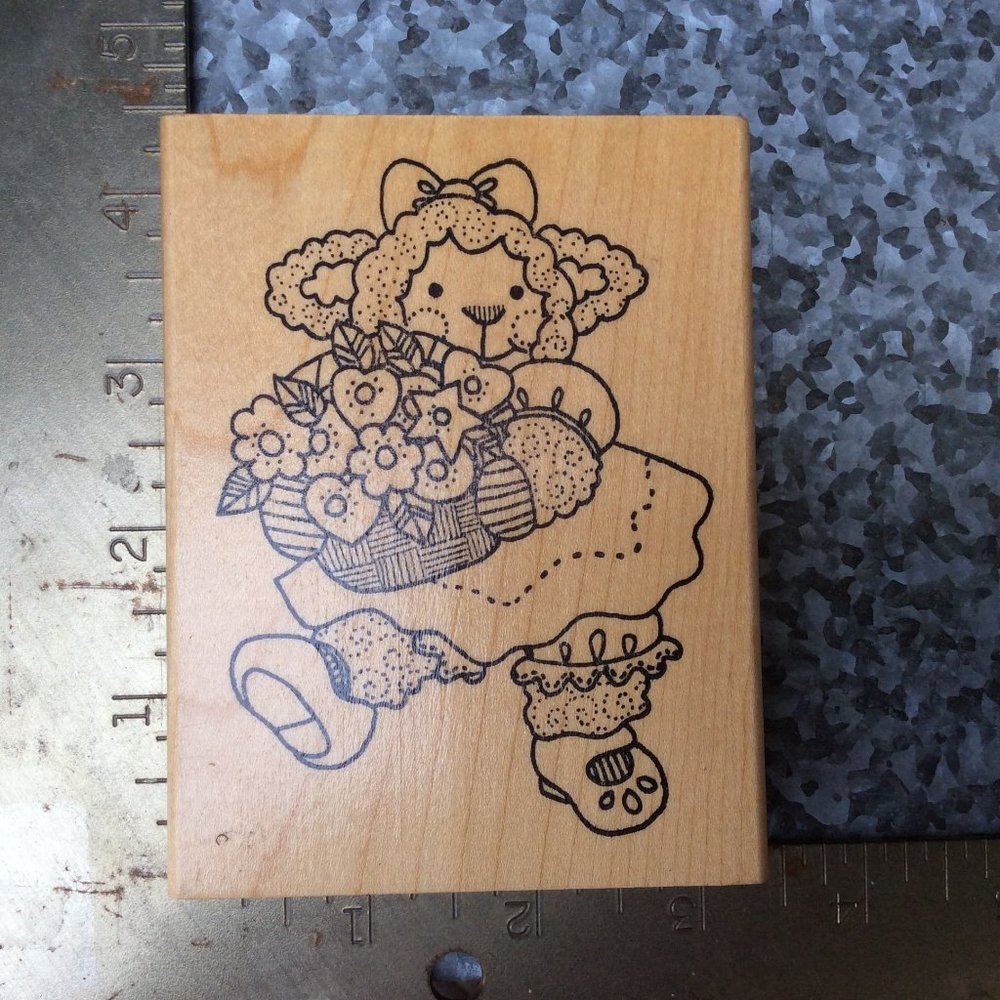 Lamb Holding Flowers by Imagine That